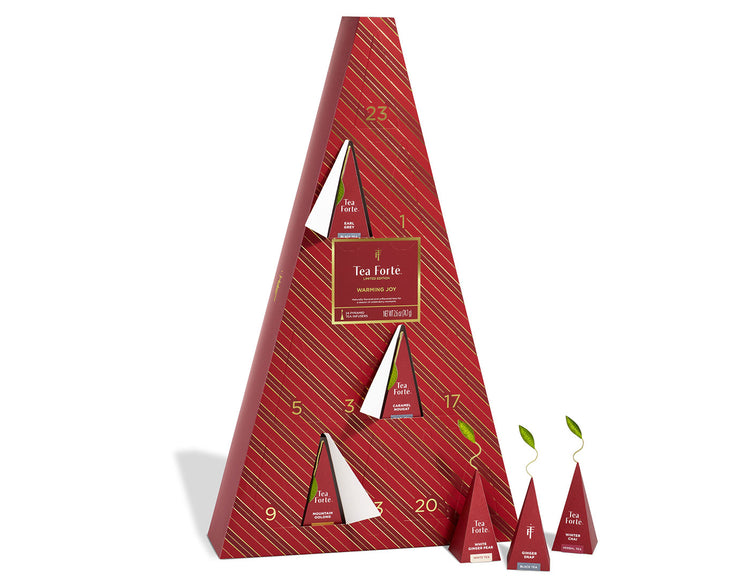 Warming Joy Advent Calendar with doors open and infusers to the right outside of box