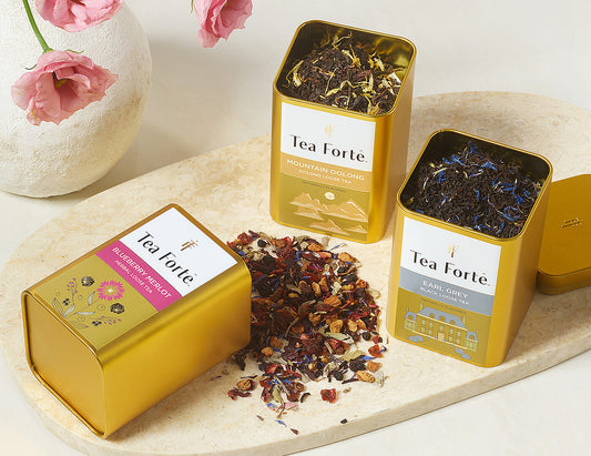 Loose Leaf Tea Canisters Blueberry Merlot Tea - 3 canisters, one with tea pouring out
