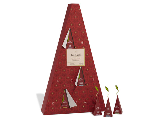Warming Joy Advent Calendar with doors open and infusers to the right outside of box