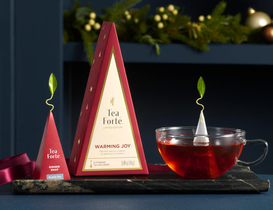 Petite Tea Tree Warming Joy, closed with glass cup and infuser on a tray