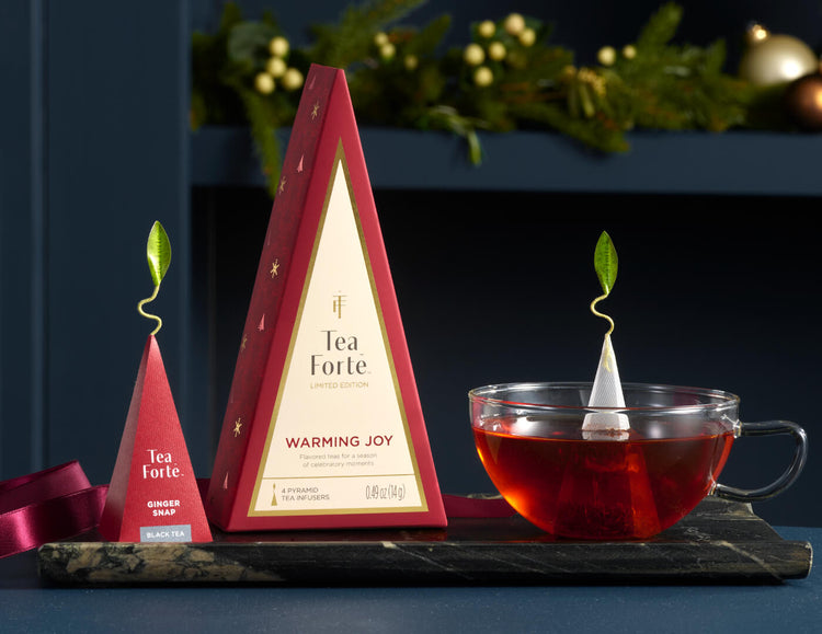 Petite Tea Tree Warming Joy, closed with glass cup and infuser on a tray