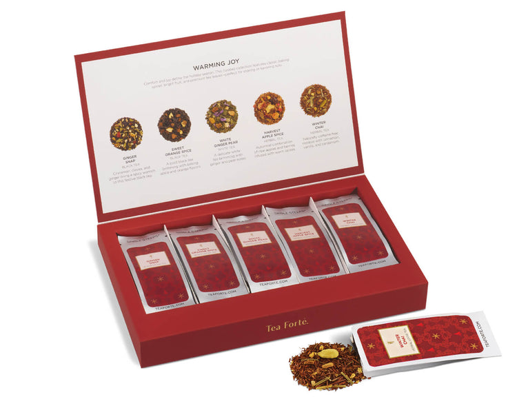 Open Single Steeps Warming Joy box with pouch spilling out tea